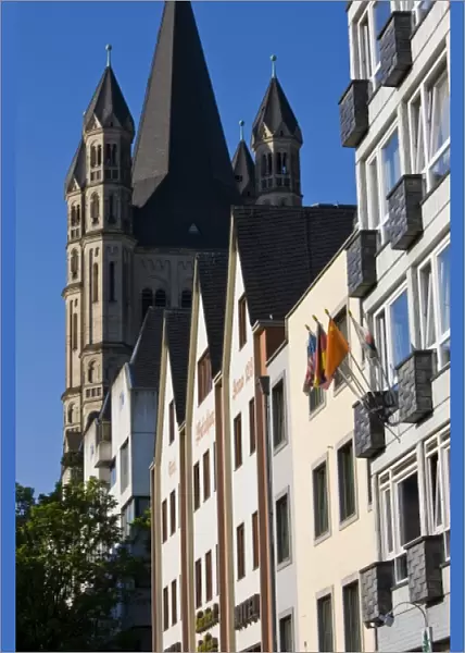 Germany, Nordrhein-Westfalen, Cologne. Rhein riverside buildings and Gross St. Martin Church