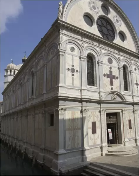 Italy, Venice. Church of Santa Maria dei Miracoli beside canal