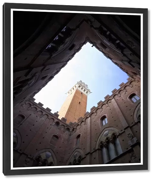 Sienna, Tuscany, Italy - Low angle view looking up from the enclosed courtyard of an old building