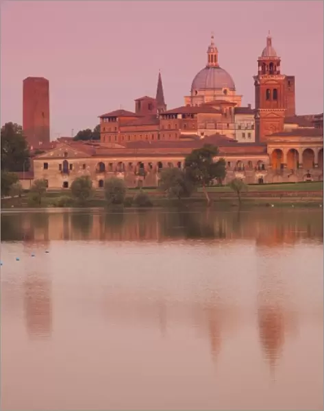 Italy, Mantua Province, Mantua. Town view and Palazzo Ducale from Lago Inferiore, dawn