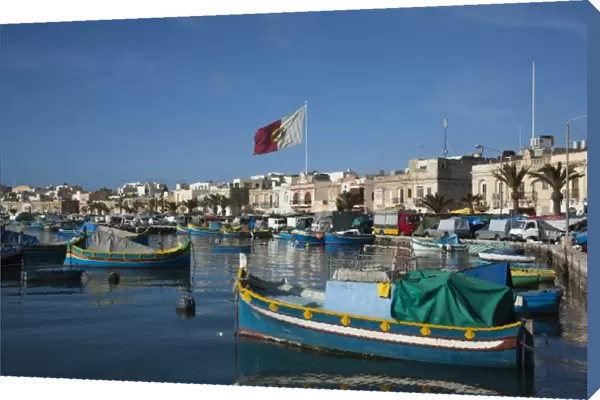 Malta, Southeast, Marsaxlokk, harbor and traditional Luzzu fishing boats