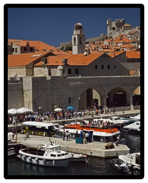 Boats docked in harbor at Old Town Dubrovnik a UNESCO World Heritage Site, Croatia