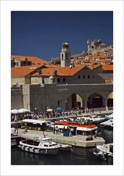 Boats docked in harbor at Old Town Dubrovnik a UNESCO World Heritage Site, Croatia