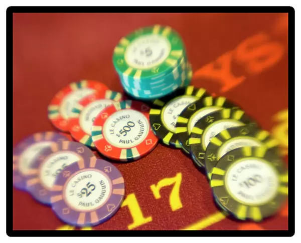 French Polynesia. Colorful poker chips on casino table aboard Paul Gaugin cruise ship