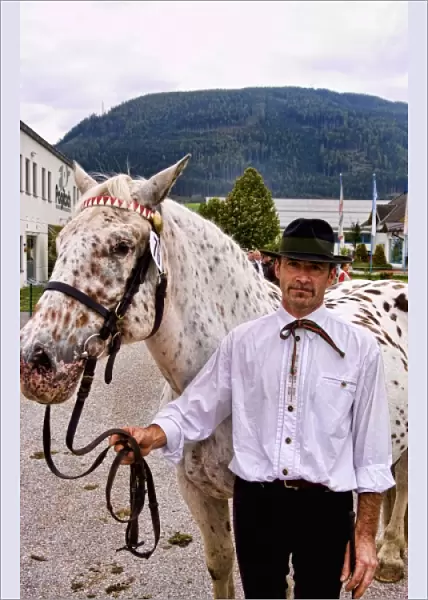 Local man with horse for show at horse show event in Tamsweg Austria alpine village