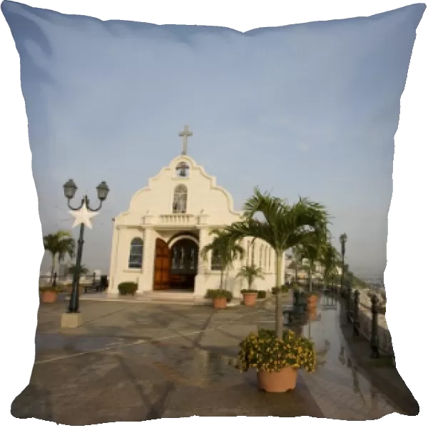 Ecuador, Guayaquil. Atop the hill of Las PeA as, a Catholic church sits across from a lighthouse