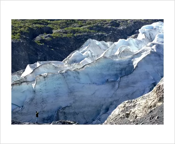 Man observing Exir Glacier, Kenai Fjords National Park, AK (MR)