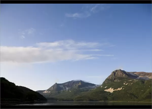 USA, Alaska, Katmai National Park, Geographic Harbor, Setting sun lights mountain