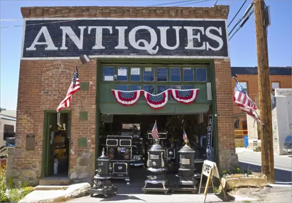 USA, Colorado, Idaho Springs. Outside of antique store decorated with American flags
