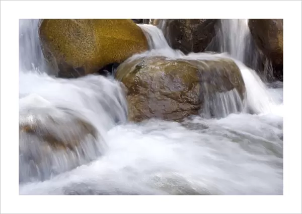 USA, California, Horse Creek. Water cascades over colorful rocks in Horse Creek in