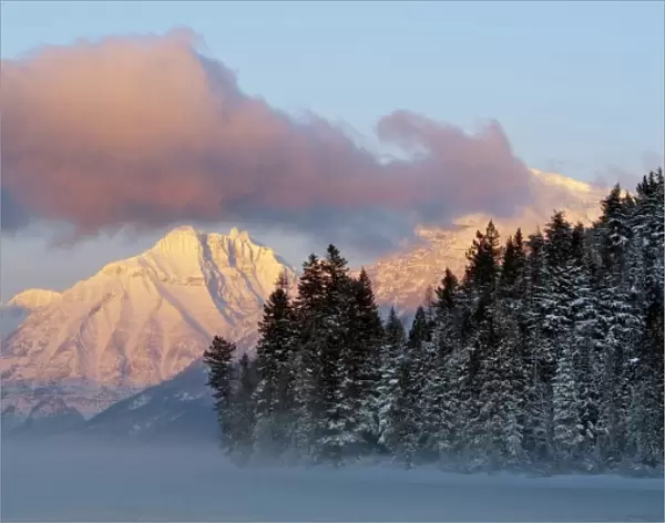 Fog rises from Lake McDonald on a very cold afternoon in Glacier National Park in Montana