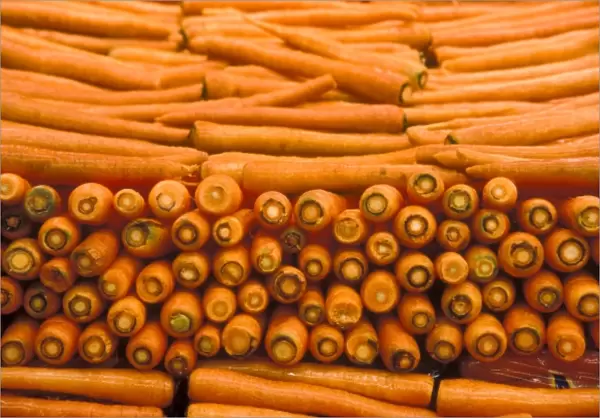Stacks of orange carrots