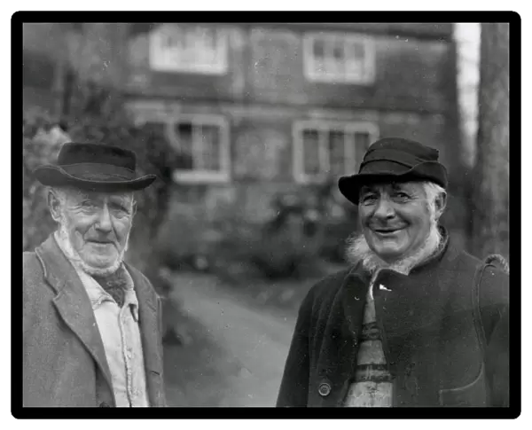 Two country gentlemen standing in front of house Petworth, Sussex