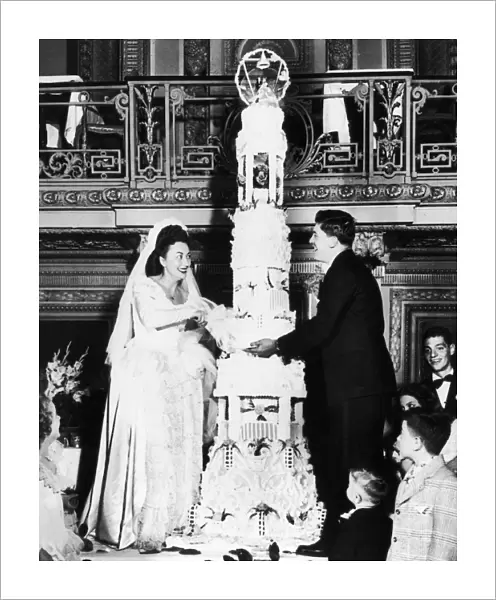 Mr. and Mrs. Thomas Tarallo cutting their wedding cake for 700 guests at a Chicago hetel, April 1947