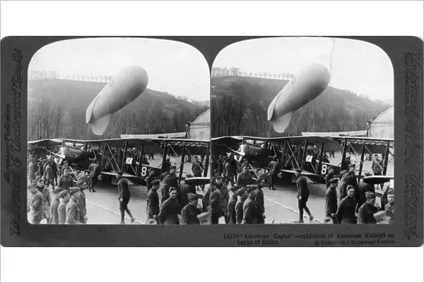 American Eagles with biplanes and airships on the banks of the Rhine River during World War I. Stereograph, c1918