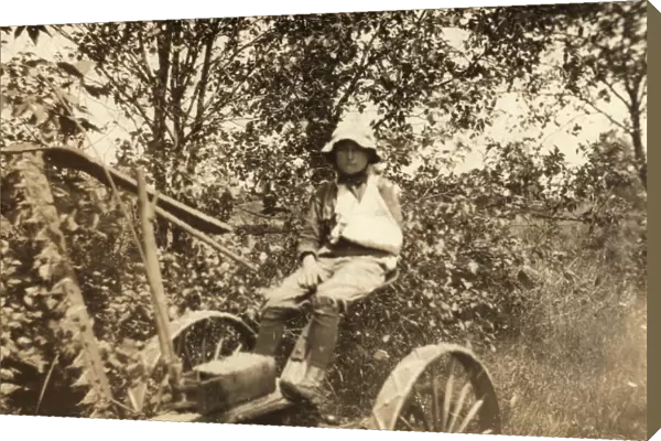 MOWING ACCIDENT, 1915. A twelve-year old boy driving the mowing machine which cut