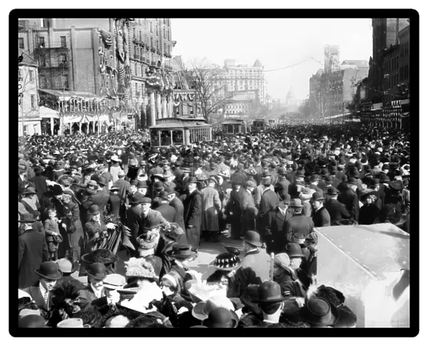 SUFFRAGE PARADE, 1913. Crowd of spectators on Pennsylvania Avenue watching the