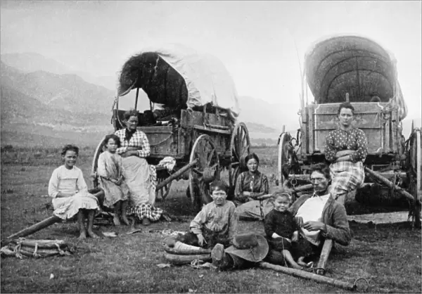 COLORADO: EMIGRANTS. A group of emigrants posing at their wagons near the foothills