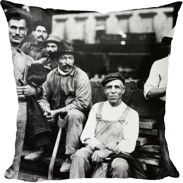 IMMIGRANT LABOR, 1910. A group of Italian immigrant street construction workers