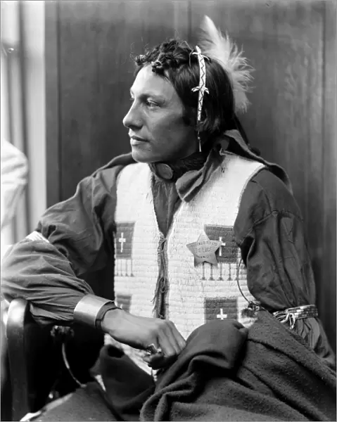 SIOUX NATIVE AMERICAN, c1900. An unidentified Sioux, a member of Buffalo Bills Wild West Show