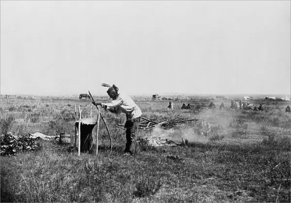 SIOUX COOKING, c1911. High Bear, a Brule Sioux Native American man on the Rosebud