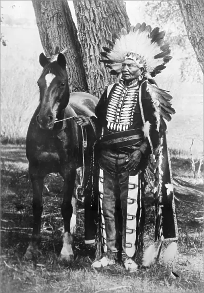 UTE CHIEF IGNACIO, c1904. Ute Chief Ignacio with his horse, in Colorado