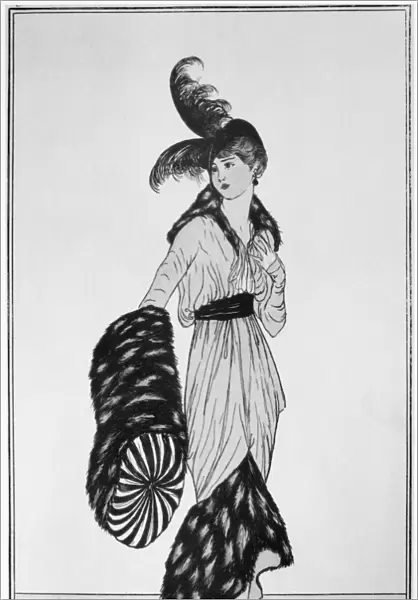 FASHION: WOMAN, 1913. A woman with a feather hat, fur muff and fur-accented dress