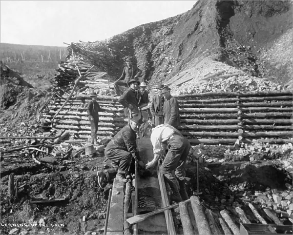 ALASKA: MINING, 1916. Men washing gold in Alaska. Photograph, 1916