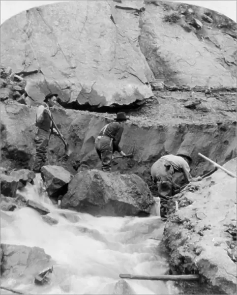 GOLD MINERS, c1898. Gold miners at work. Stereograph, c1898