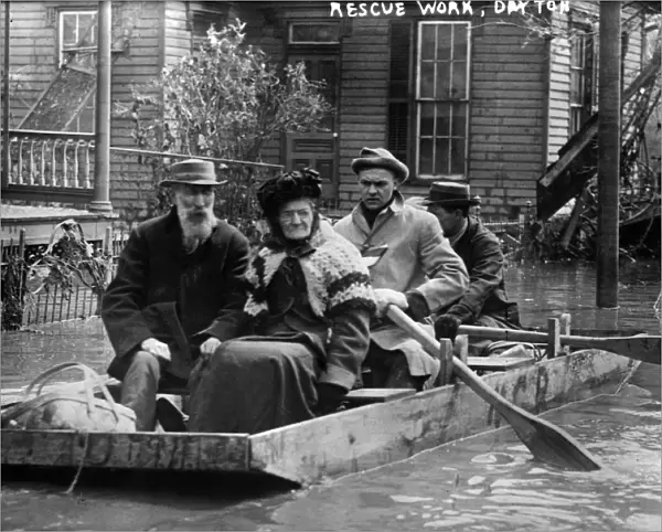 DAYTON FLOOD, 1913. Workers rescuing an elderly couple in a rowboat after the flood in Dayton