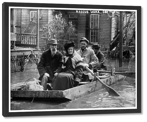 DAYTON FLOOD, 1913. Workers rescuing an elderly couple in a rowboat after the flood in Dayton