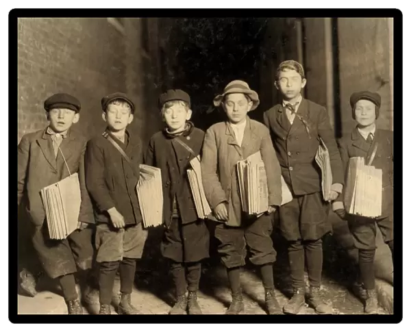 HINE: NEWSBOY, 1909. A group of newsboys at work at night in Newark, New Jersey