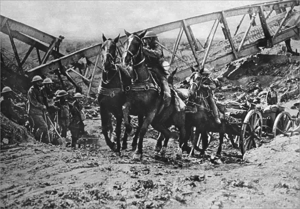 WORLD WAR I: ARTILLERY. British field artillery crossing a dry canal bed because