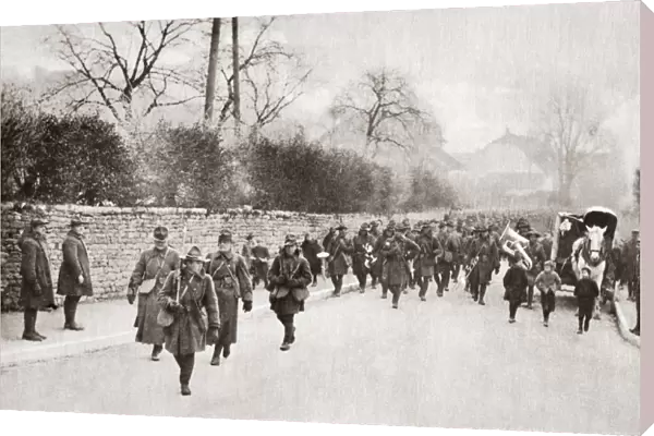 WWI: AMERICAN TROOPS. American troops marching through a village in France during World War I
