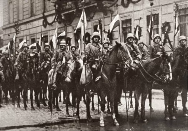 WORLD WAR I: BERLIN, C1918. Squadron of Prussian Cavalry with decorated flagstaffs