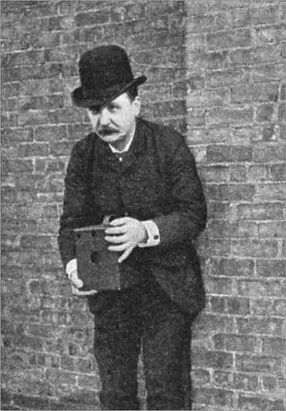 DETECTIVE CAMERA, 1889. Operating a detective camera