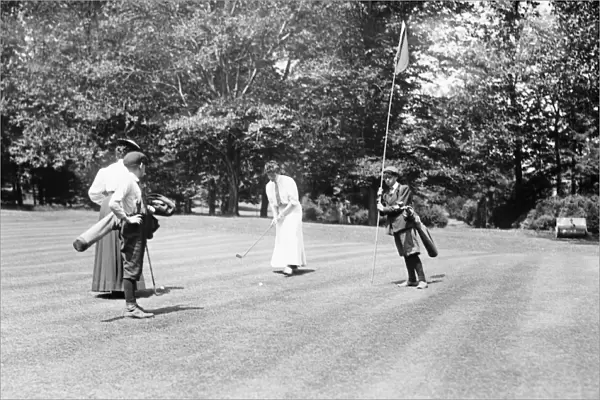 GOLF TOURNAMENT, 1908. Miss A. Irving playing in a golf tournament at the Essex