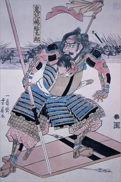 JAPAN: SAMURAI. Samurai warrior on his shield, holding the head of one of his victims