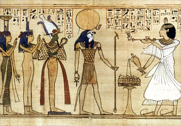 EGYPT: BOOK OF THE DEAD. The god Ra-Harakhti, center, on an Egyptian papyrus Book of the Dead