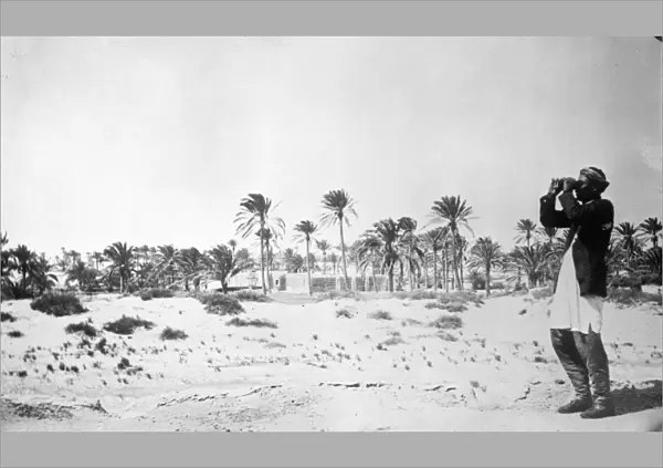 LIBYA: MISRATAH, c1911. A man with binoculars at the oasis city of Misratah in northwestern Libya