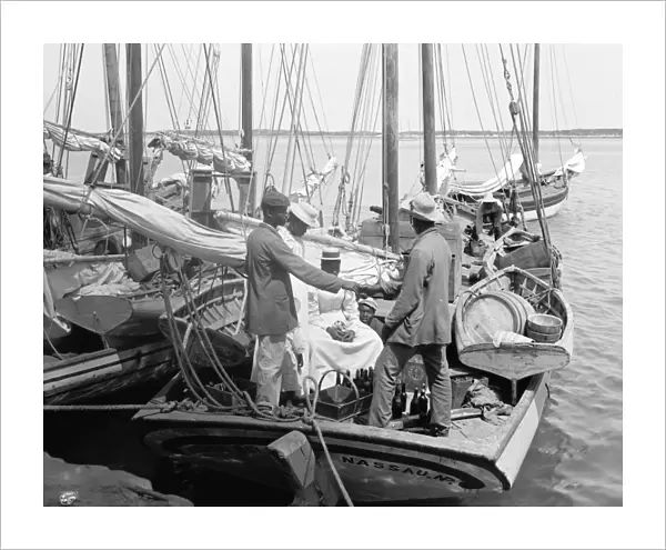 BAHAMAS, c1900. Sponge fishermen on boats in a harbor in Nassau, New Providence Island, Bahamas