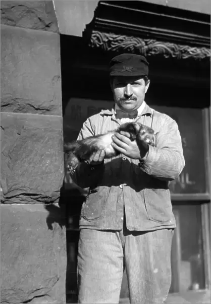 NEW YORK: RAT CATCHER, c1908. A rat catcher holding a ferret, used to hunt rats
