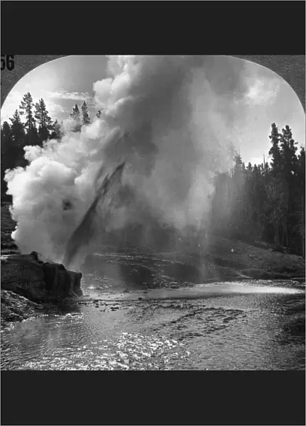 YELLOWSTONE PARK: GEYSER. The Riverside Geyser spouts its 100-feet jet obliquely