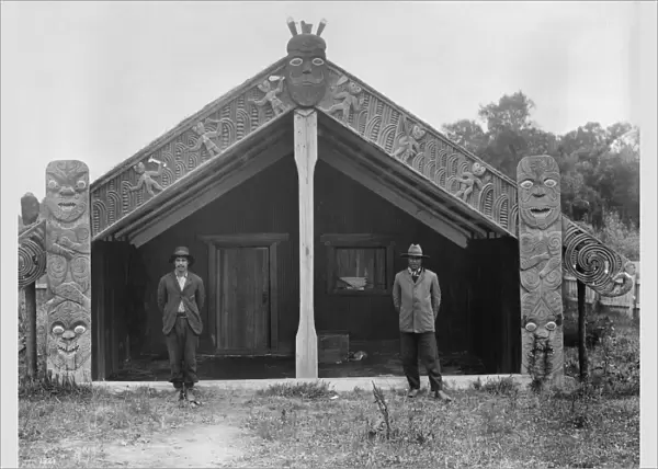 NEW ZEALAND, c1920. Maori men in front of a meeting house in New Zealand. Photograph