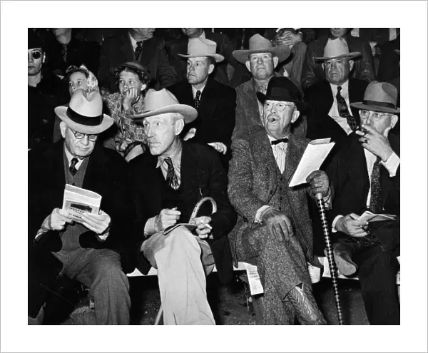 CATTLE AUCTION, 1940. Cattlemen at auction of prize beef steers and breeding stock at San Angelo