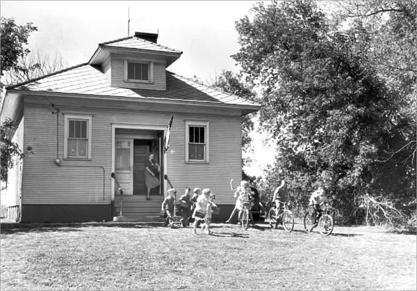 SCHOOLHOUSE, 1939. Children leaving school for the day, Grundy County, Iowa. Photograph