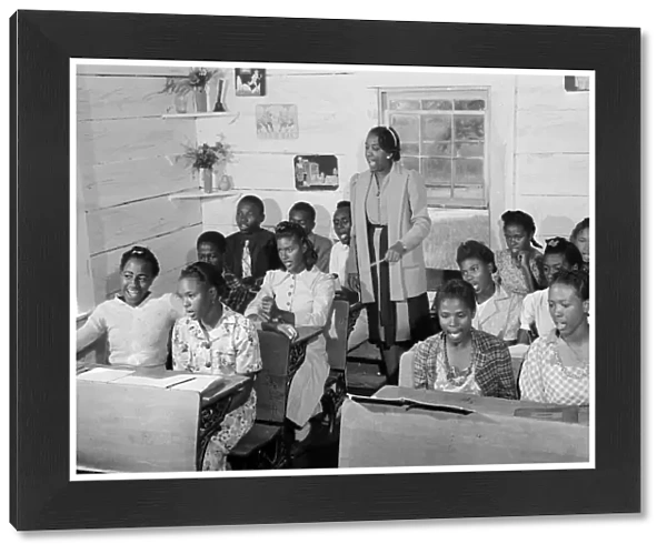 SEGREGATED SCHOOL, 1941. An African American singing class in a rural one room schoolhouse