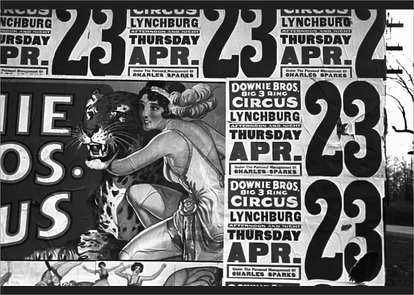 CIRCUS ADVERTISEMENT, 1936. Posters covering the side of a building advertising the Downie Brothers three ring circus near Lynchburg, South Carolina. Photograph by Walker Evans, 1936