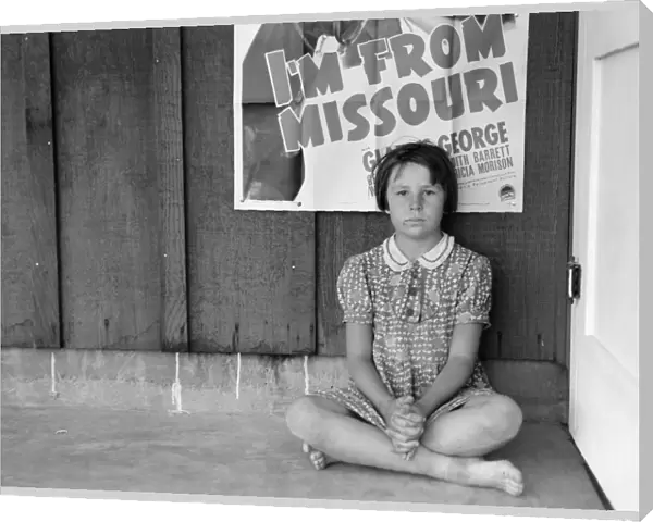 FLOOD REFUGEE, 1939. A young flood refugee from Missouri in Westley, California