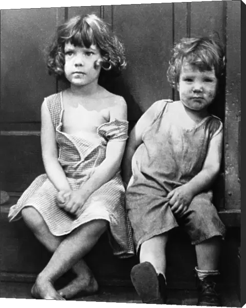 POVERTY: CHILDREN, 1935. Two impovished children in the slum section of Georgetown, Washington, D